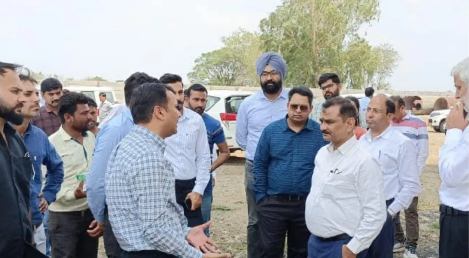 State representatives in discussion at a project field site
